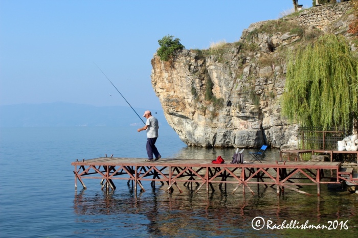 After getting their daily catch, fisherman sip morning coffees alongside Ohrid's growing tourist population